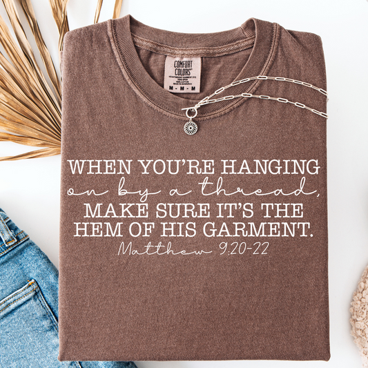 HANGING BY A THREAD T-SHIRT