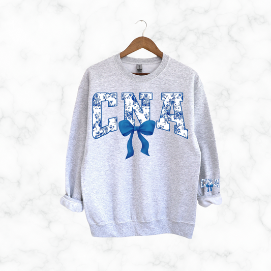CNA FLORAL BLUE BOW SWEATSHIRT